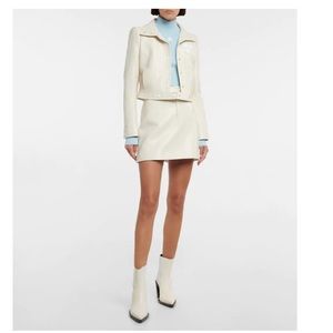 COURRÈGES
Logo ribbed-knit turtleneck sweater